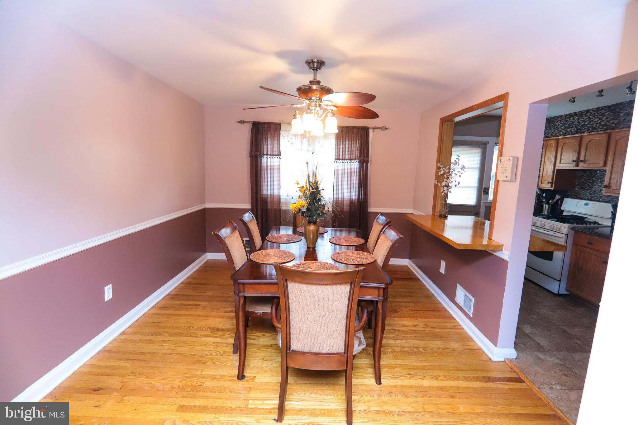 1695 Langford Road Baltimore, MD 21207 - Photo 7 of 37 Dining Room with Ceiling Fan & Hardwood Floors