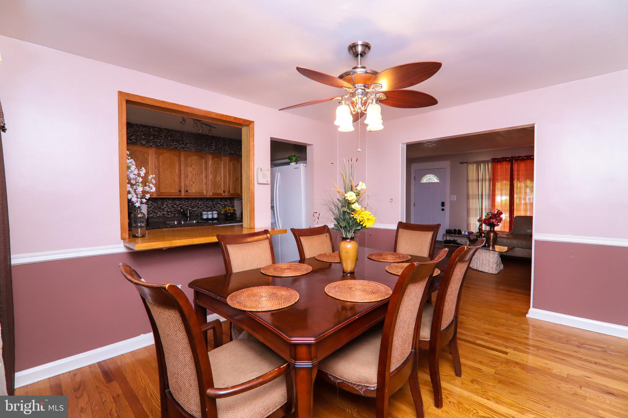 1695 Langford Road Baltimore, MD 21207 - Photo 8 of 37 Dining Room with Ceiling Fan & Hardwood Floors