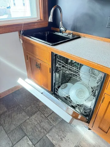 a bathroom with a shower and a sink