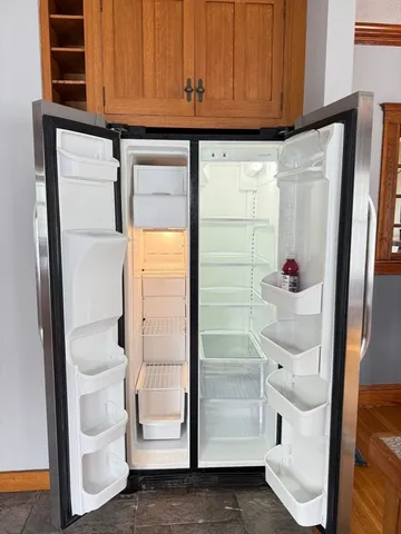 a stove top oven sitting next to a window