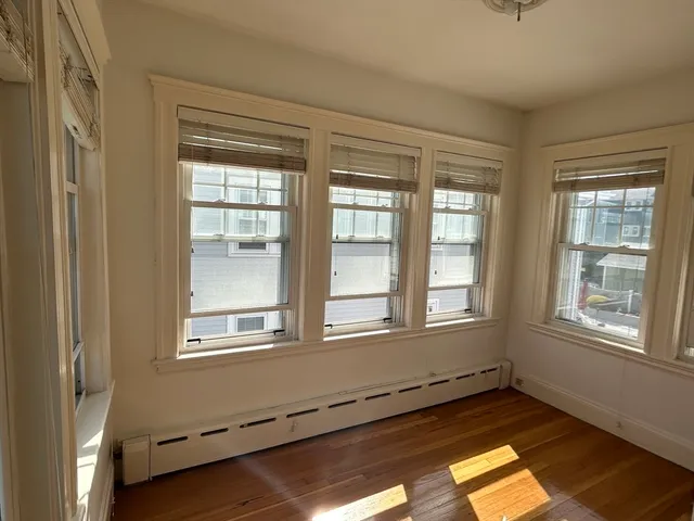 a view of entryway with wooden floor and stairs