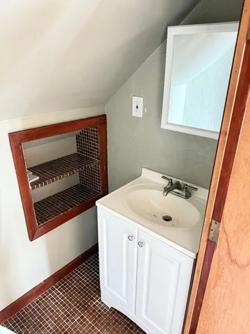 a bathroom with a toilet and a sink