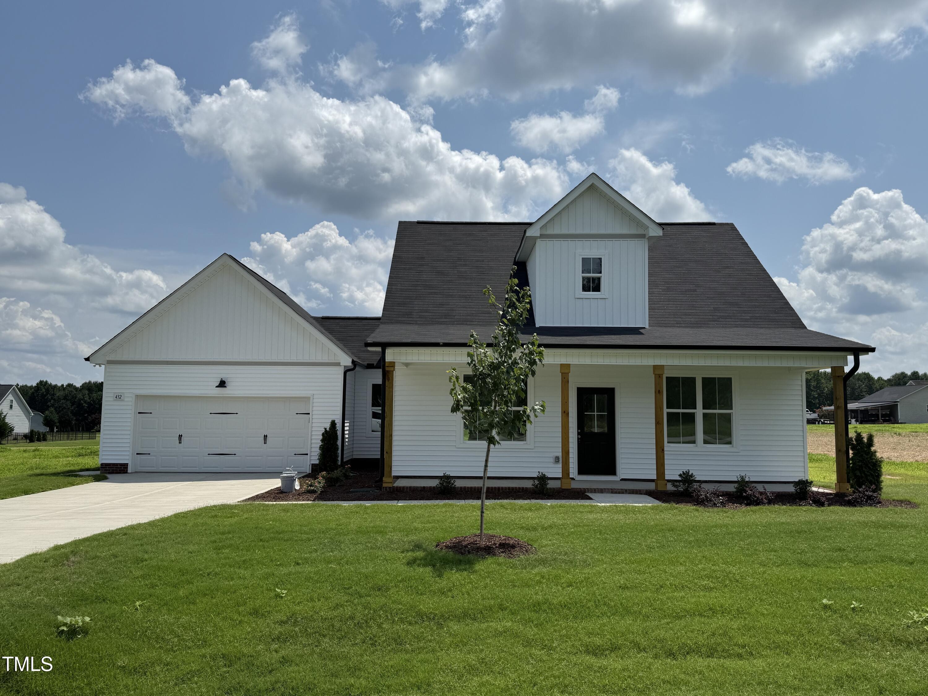 a house view with a garden space