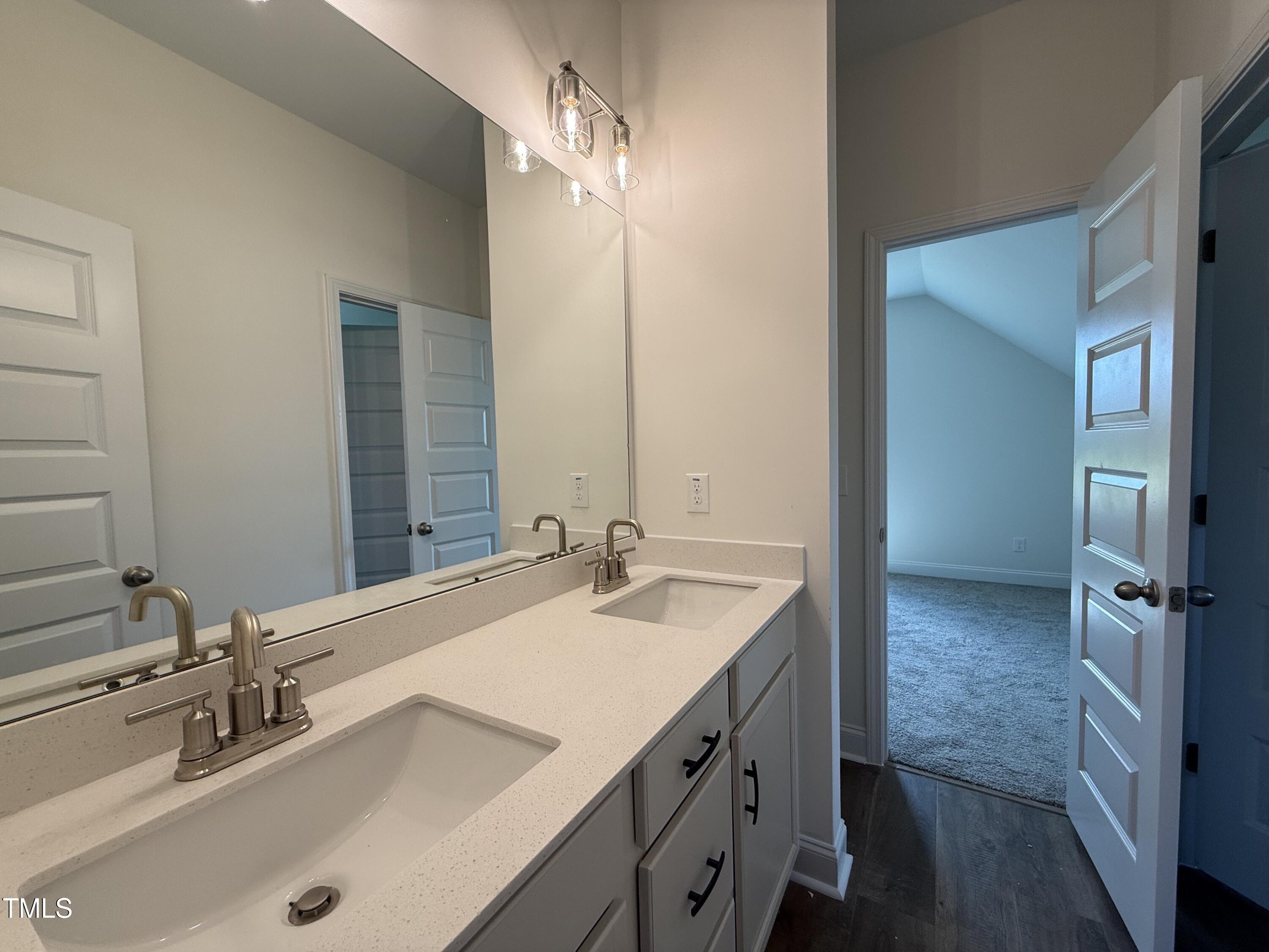 432 Springtooth Drive Zebulon, NC 27597 - Photo 12 of 15 a bathroom with a double vanity sink mirror and double