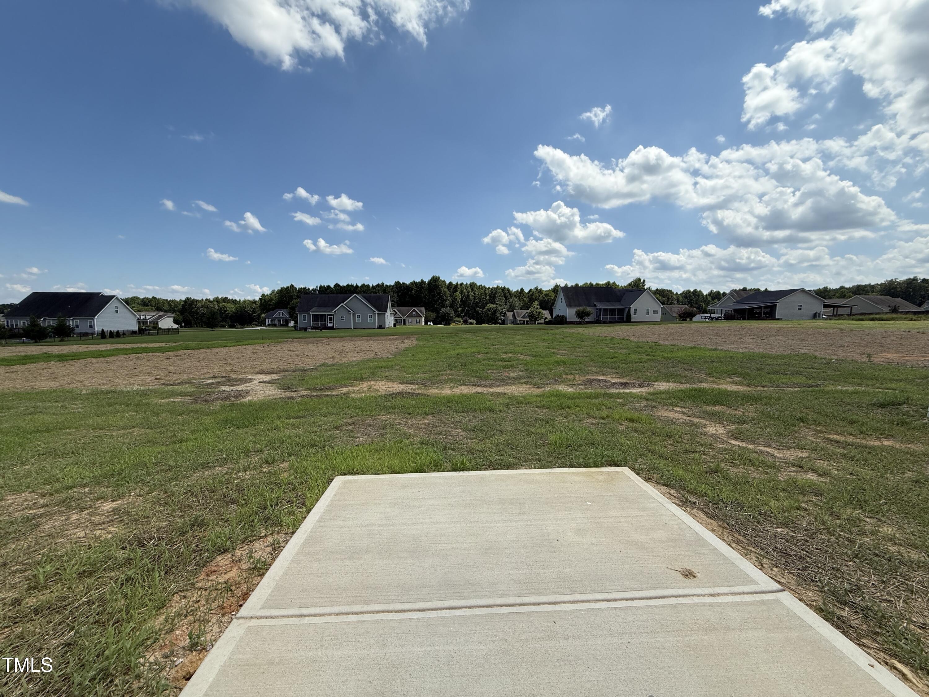 432 Springtooth Drive Zebulon, NC 27597 - Photo 13 of 15 a view of a golf course with a lake