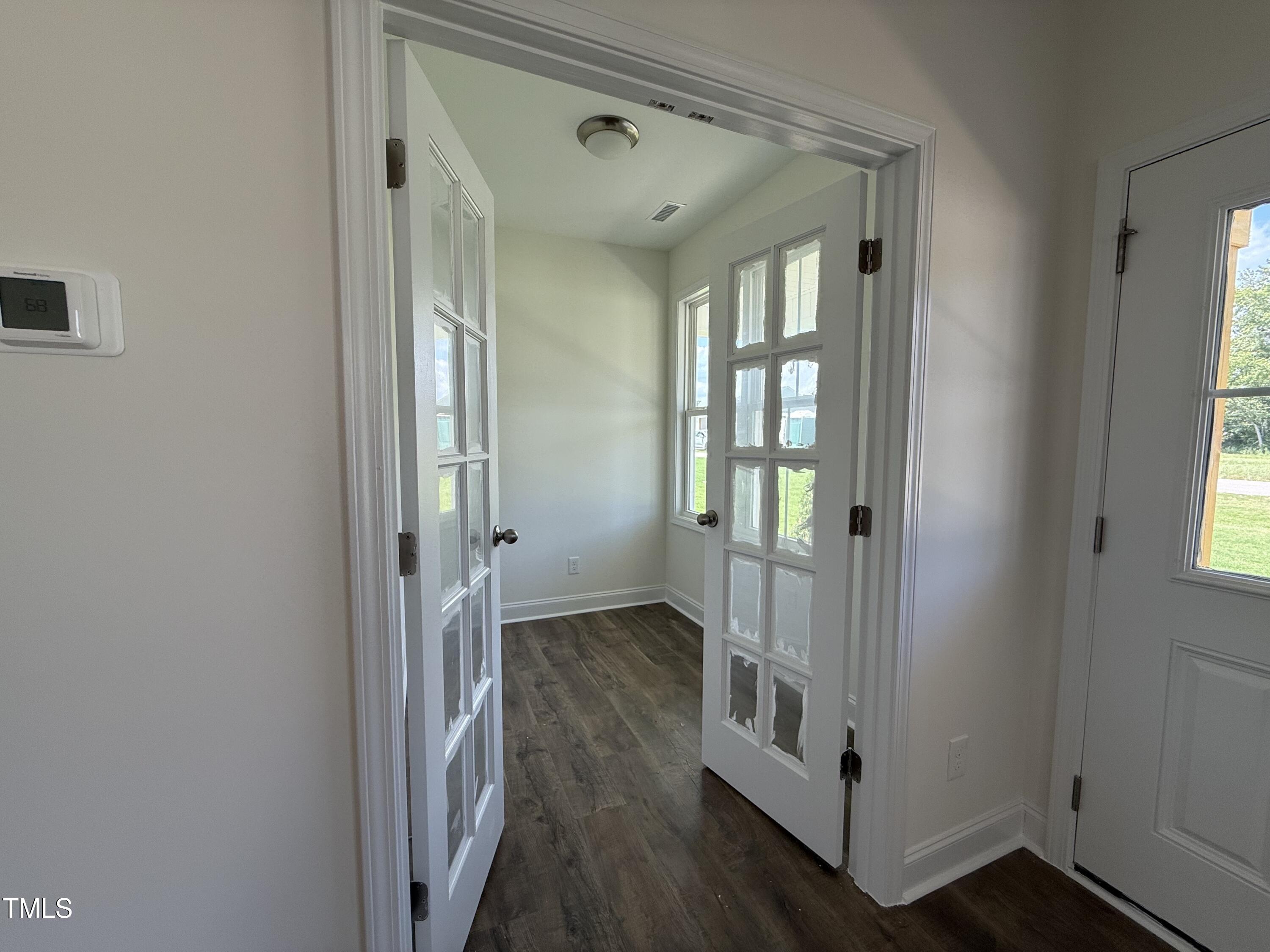 432 Springtooth Drive Zebulon, NC 27597 - Photo 9 of 15 a view of a hallway with wooden floor and closet