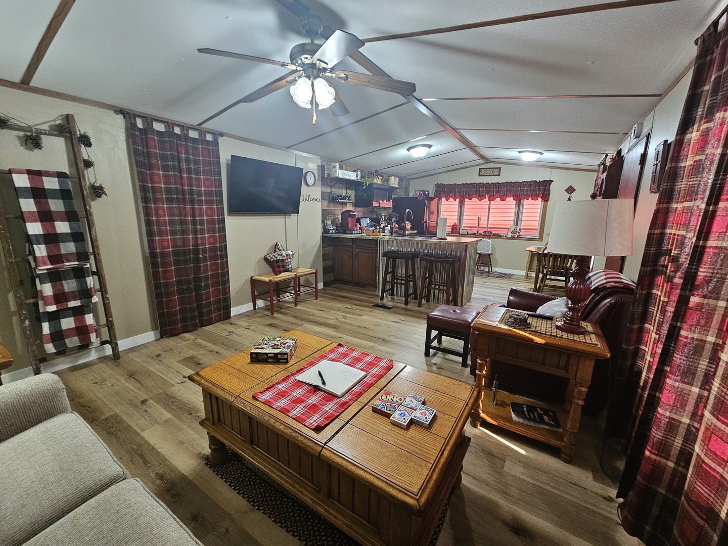 190 West 5th Street Bonnie, IL 62816 - Photo 13 of 25 a living room with furniture a flat screen tv and a fireplace