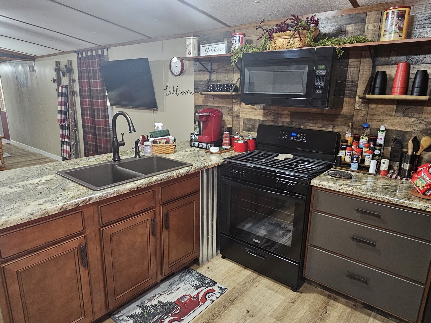190 West 5th Street Bonnie, IL 62816 - Photo 17 of 25 a kitchen with granite countertop a sink stove and cabinets