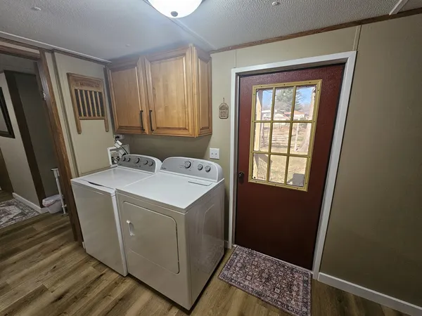 a bedroom with bed and a mirror