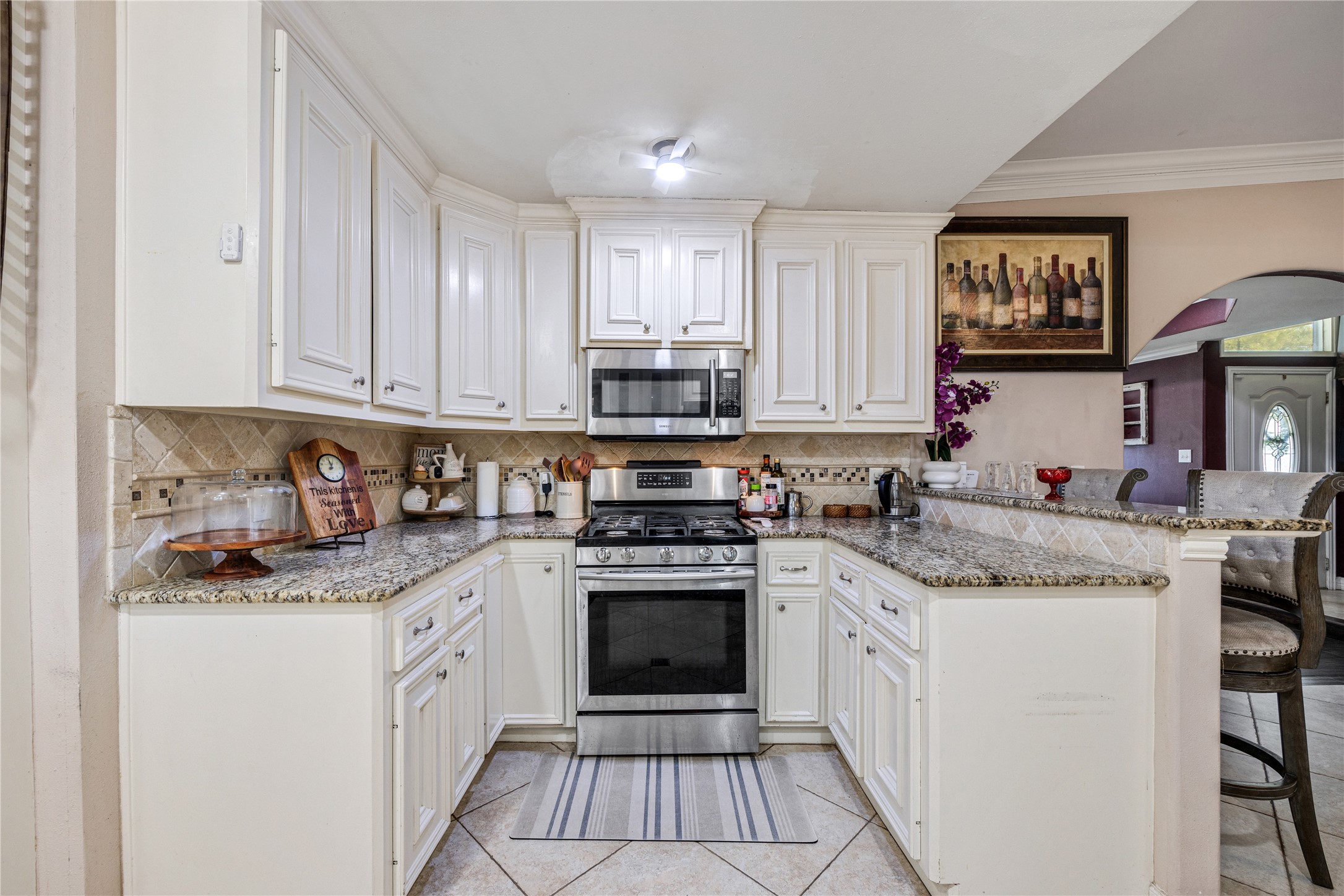 922 Gilpin Street Houston, TX 77034 - Photo 11 of 26 a kitchen with stainless steel appliances granite countertop a stove sink and cabinets