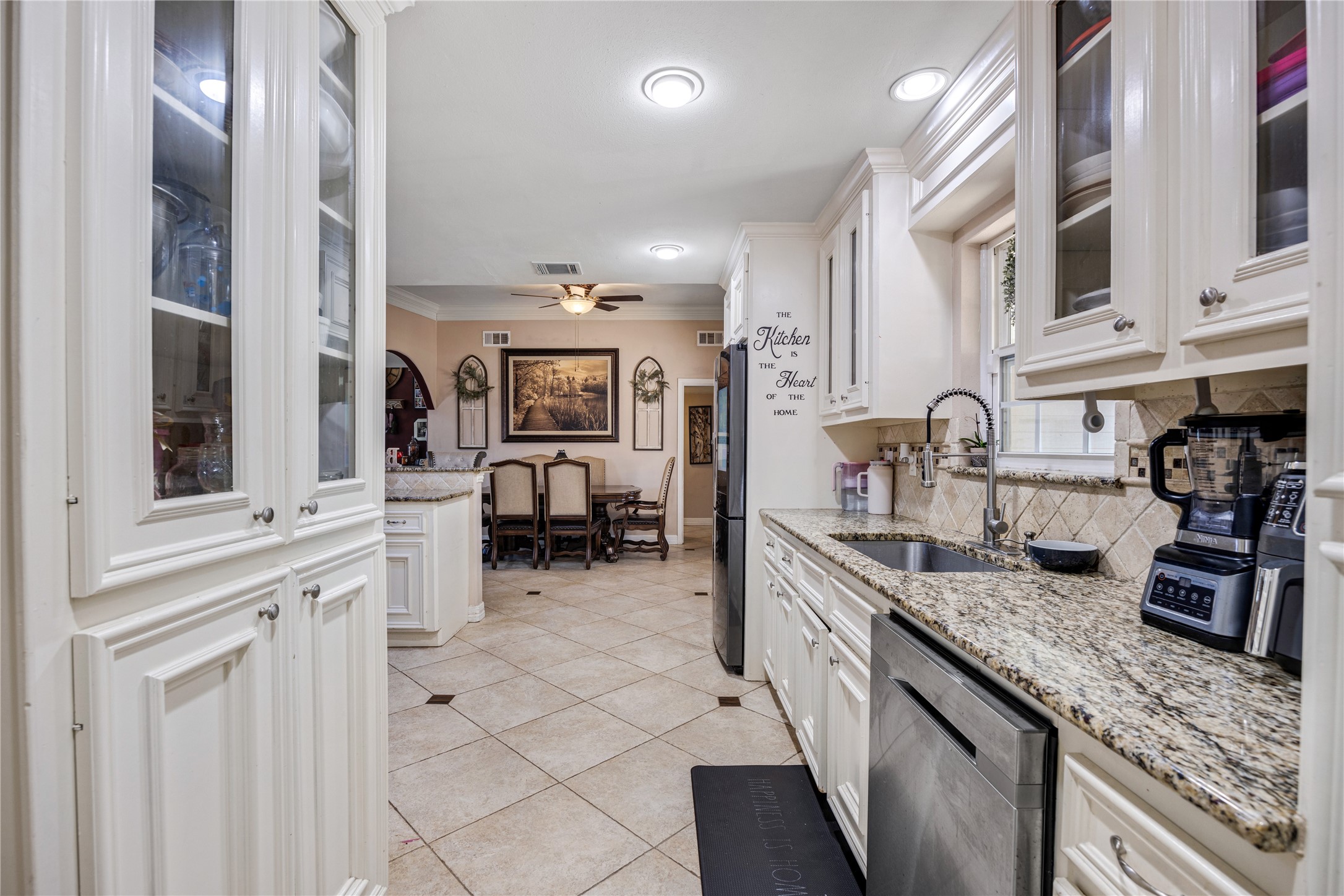 922 Gilpin Street Houston, TX 77034 - Photo 12 of 26 a kitchen with cabinets and chairs