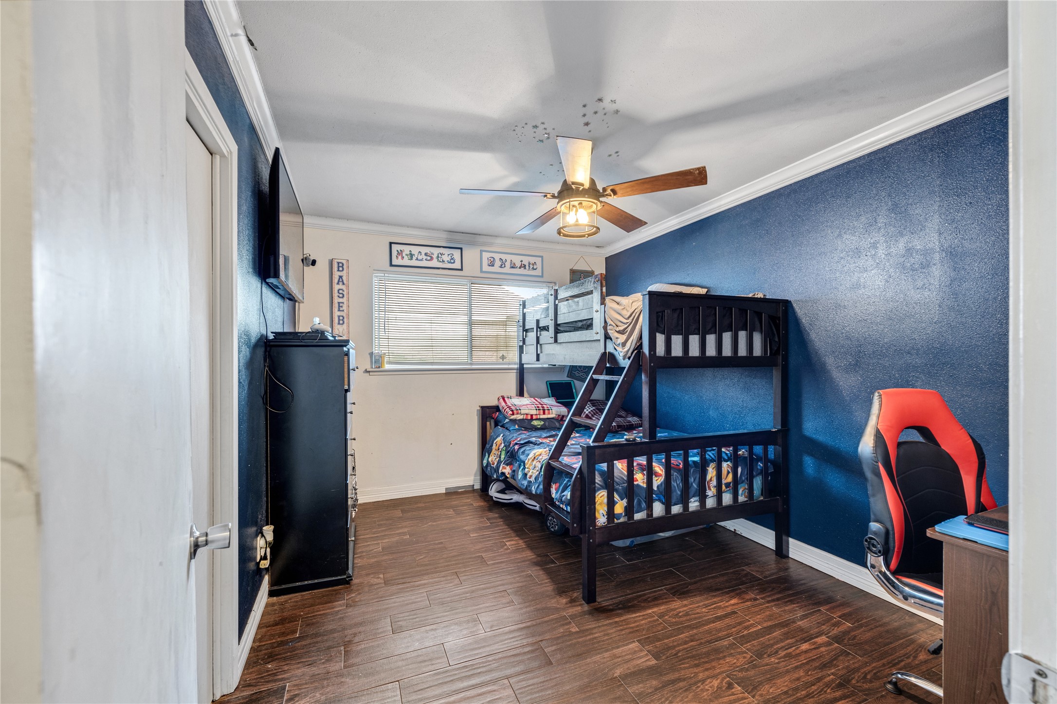 922 Gilpin Street Houston, TX 77034 - Photo 16 of 26 a bedroom with furniture and a chandelier