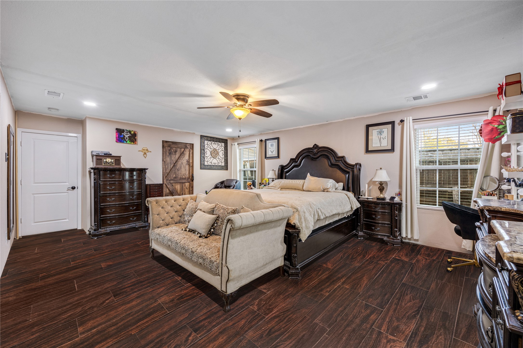 922 Gilpin Street Houston, TX 77034 - Photo 18 of 26 a spacious bedroom with a bed and wooden floor