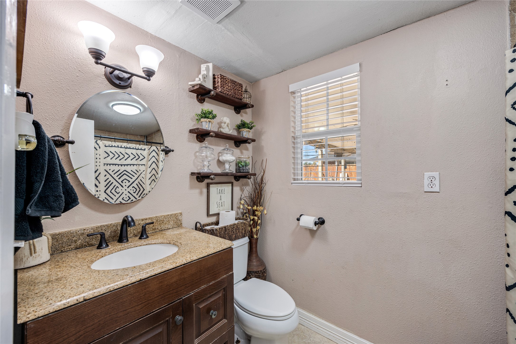 922 Gilpin Street Houston, TX 77034 - Photo 21 of 26 a bathroom with a granite countertop toilet sink and mirror