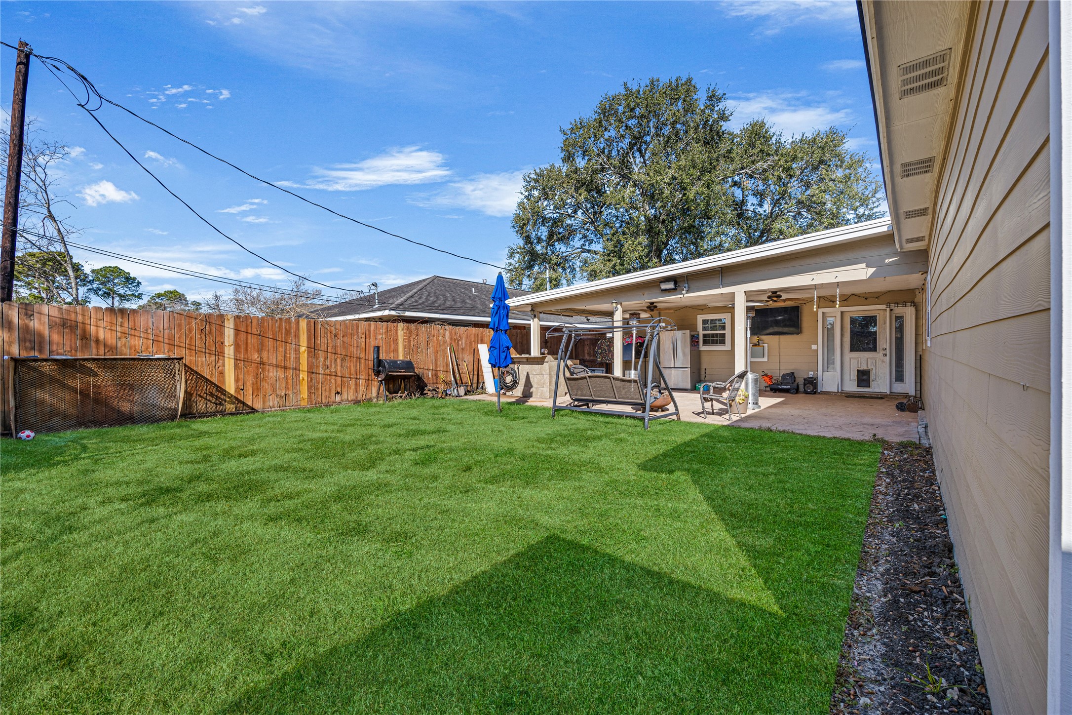 922 Gilpin Street Houston, TX 77034 - Photo 23 of 26 a view of a house with a backyard porch and sitting area