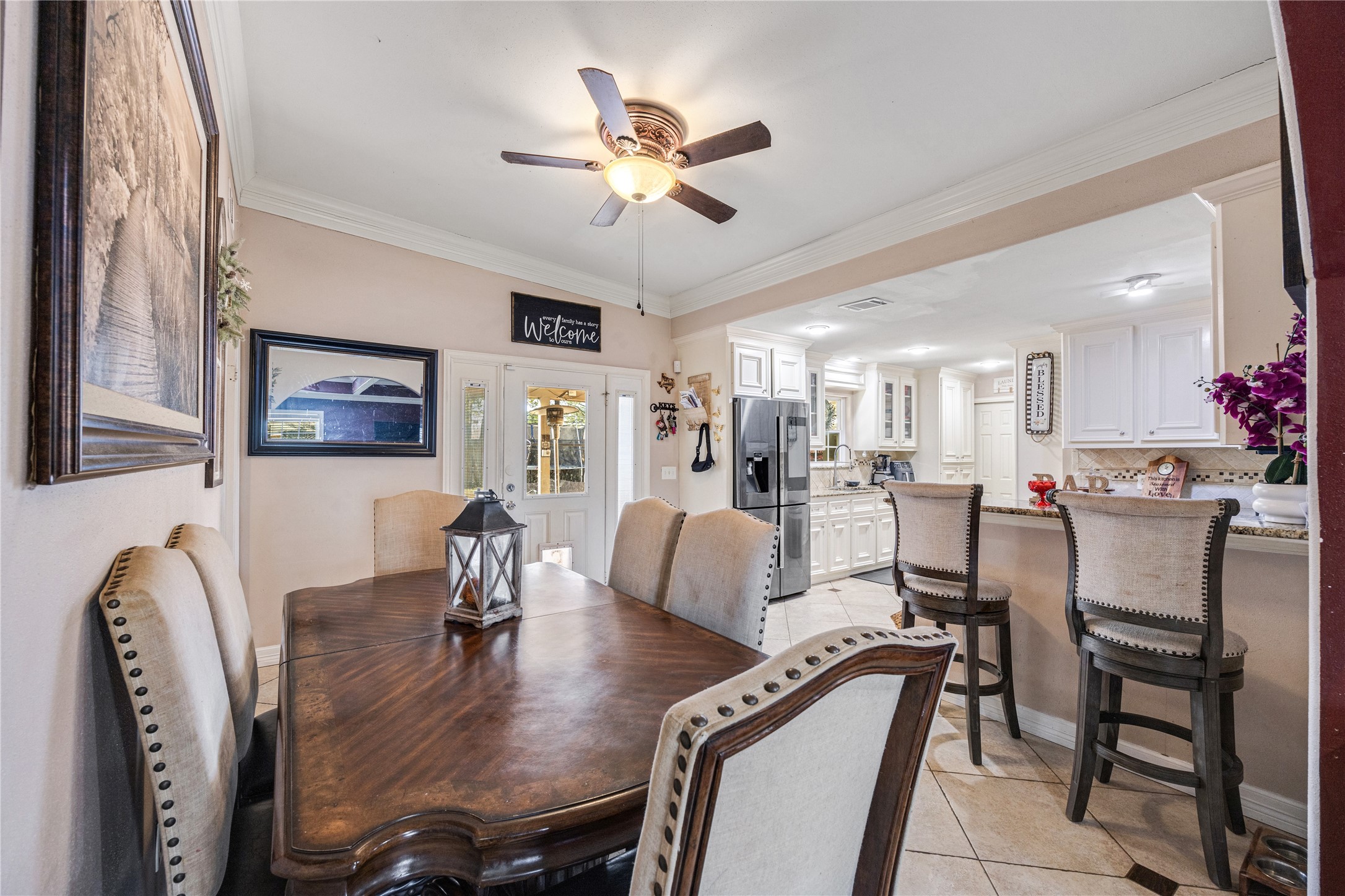 922 Gilpin Street Houston, TX 77034 - Photo 7 of 26 a view of a dining room with furniture and a chandelier