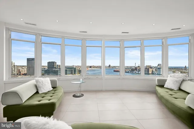 a large kitchen with kitchen island a sink a stove and a refrigerator