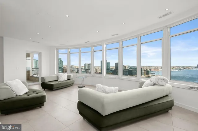 a living room with a large window and a table
