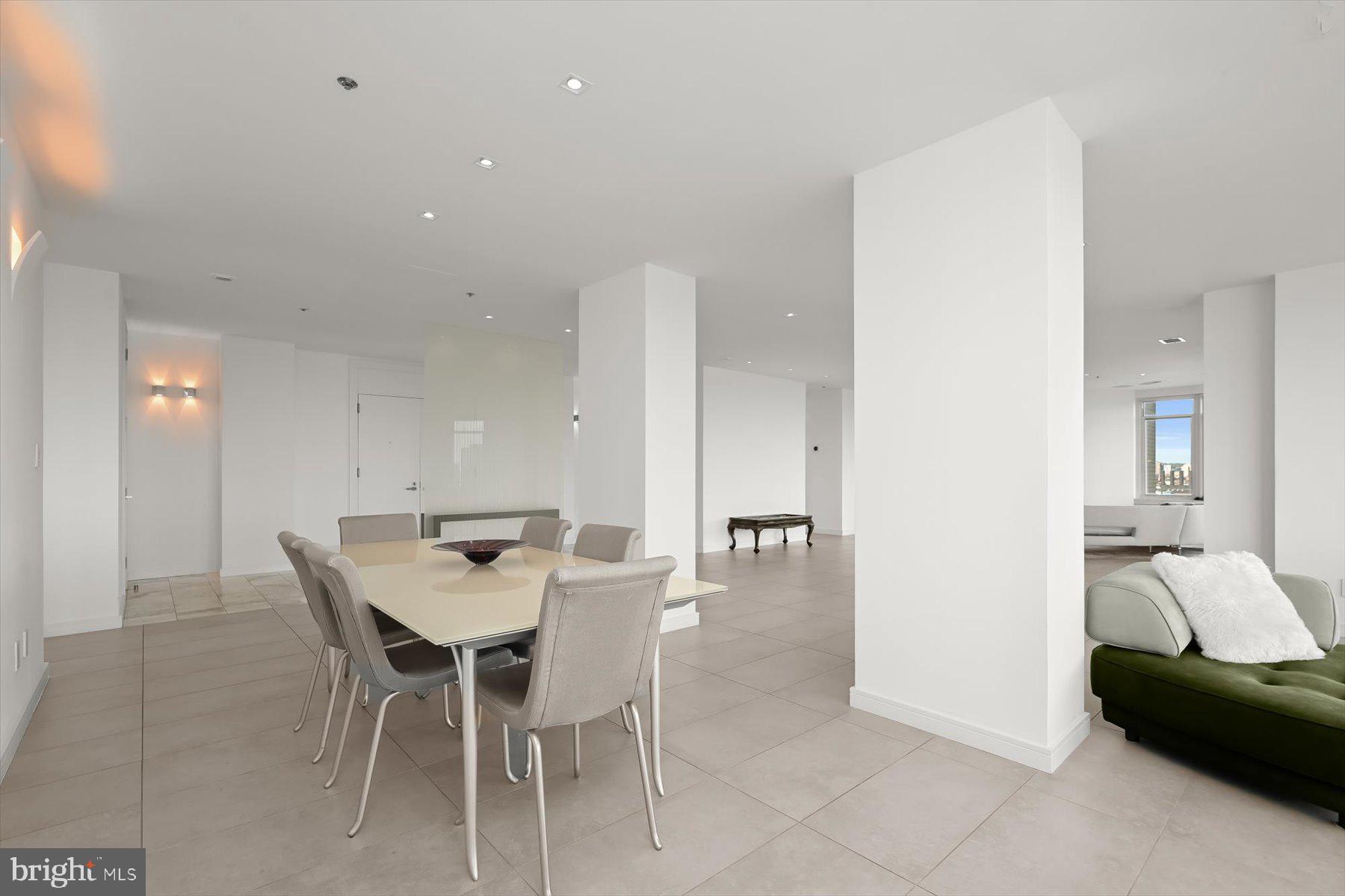 100 Harborview Drive, Unit 1901 Baltimore, MD 21230 - Photo 16 of 107 a view of a dining room with furniture