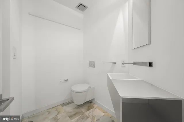 a spacious bedroom with a bed and a table