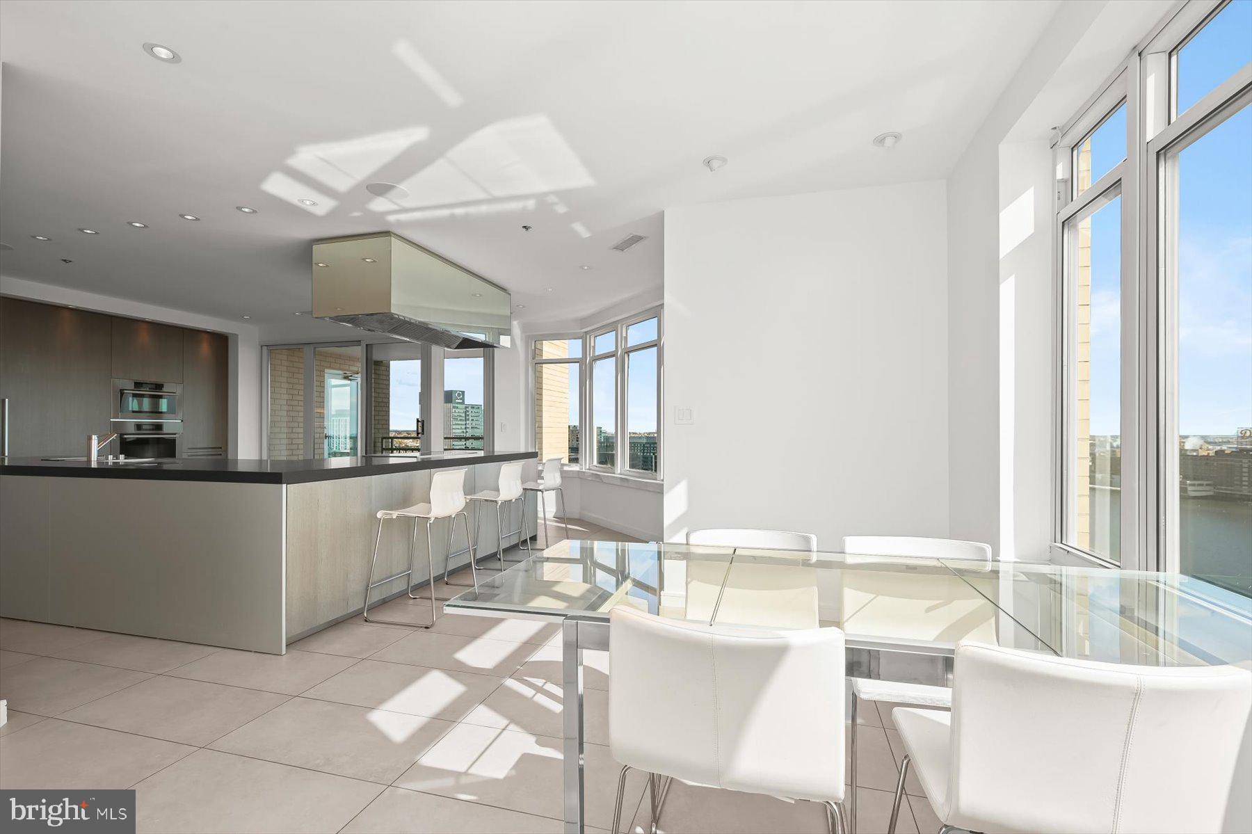 100 Harborview Drive, Unit 1901 Baltimore, MD 21230 - Photo 28 of 107 a large white kitchen with a large window