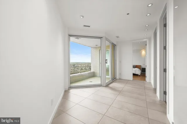 a bed room with a bed and a large window