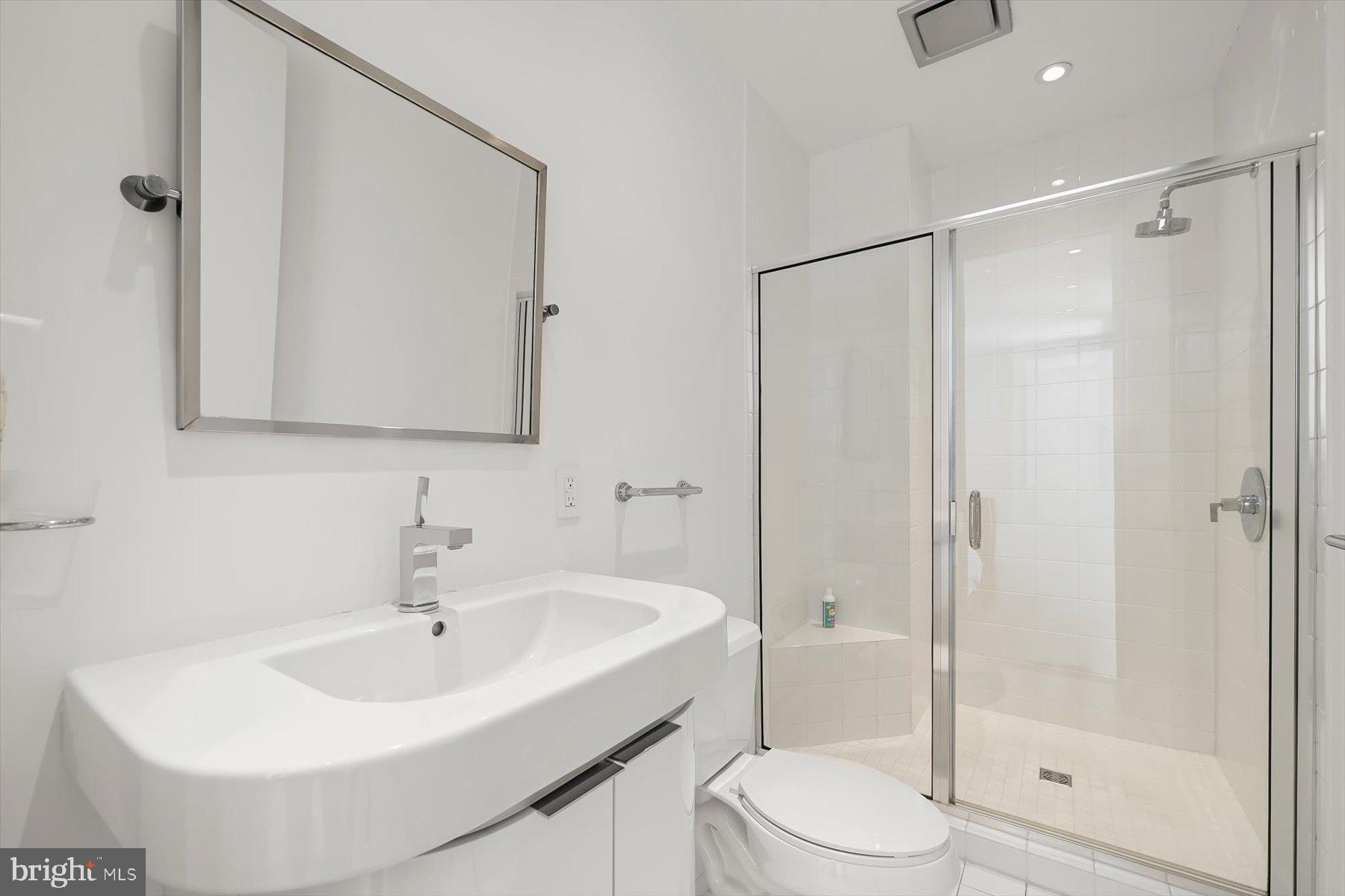 100 Harborview Drive, Unit 1901 Baltimore, MD 21230 - Photo 39 of 107 a bathroom with a sink toilet and shower