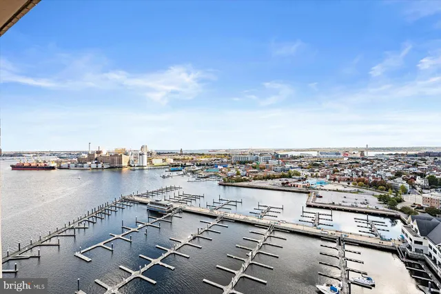 a kitchen with stainless steel appliances granite countertop a sink and wooden cabinets