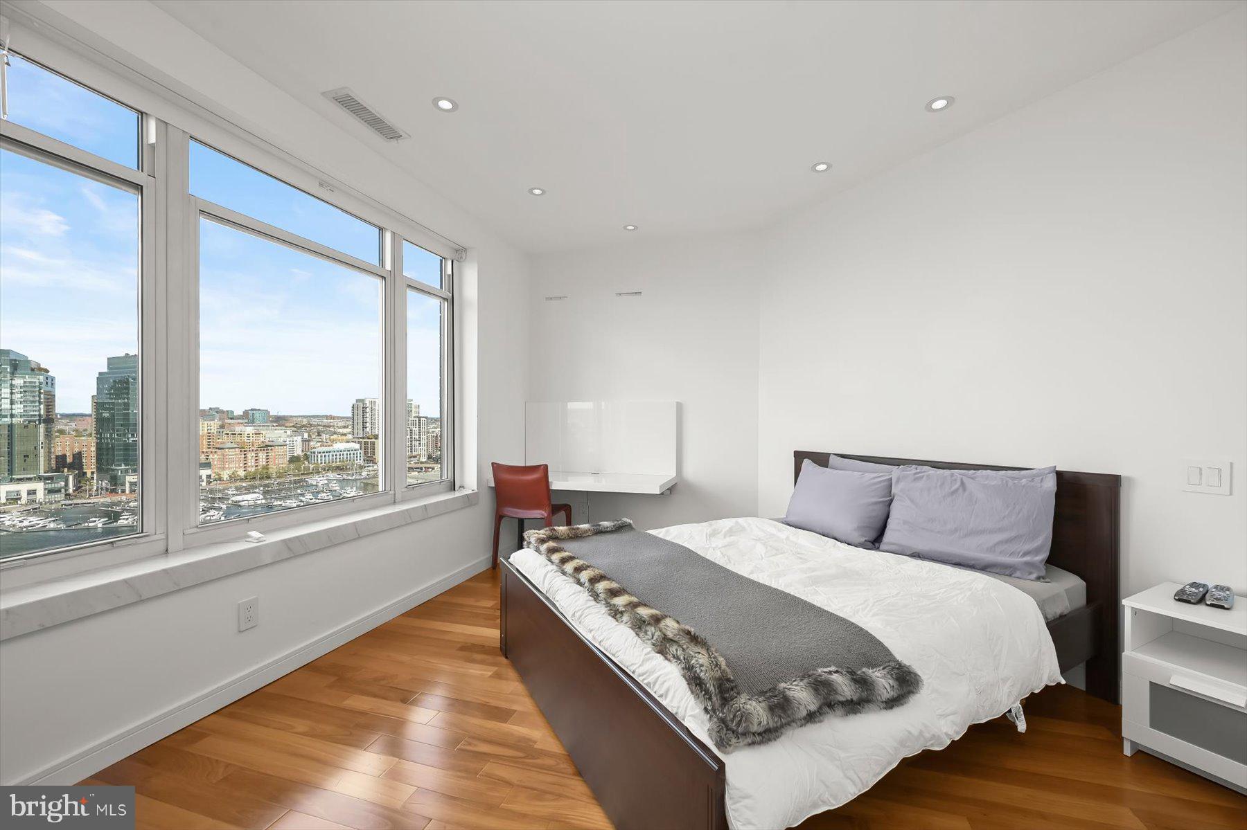 100 Harborview Drive, Unit 1901 Baltimore, MD 21230 - Photo 50 of 107 a bed room with a bed and a large window