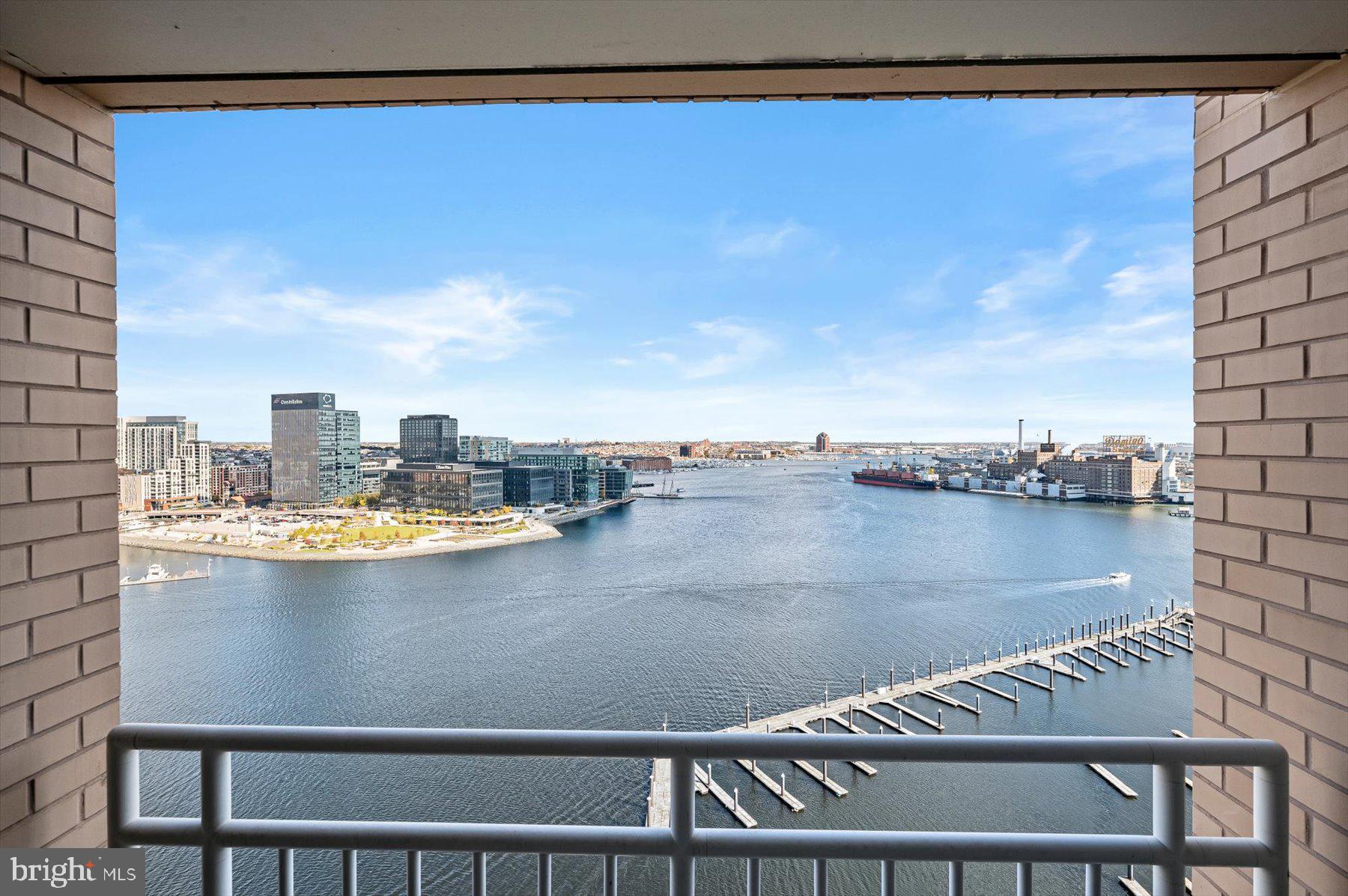 100 Harborview Drive, Unit 1901 Baltimore, MD 21230 - Photo 7 of 107 a view of swimming pool with outdoor seating and city view