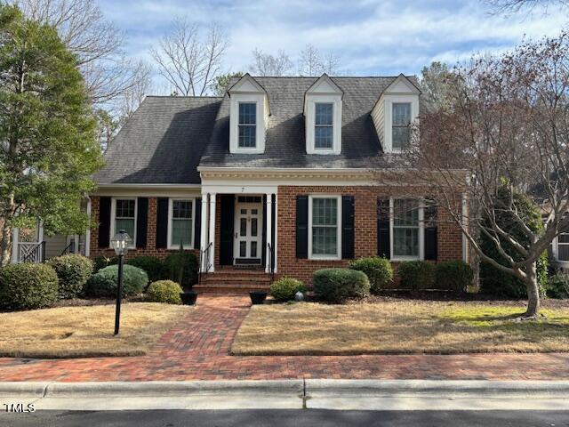 7 Hastings Square Durham, NC 27707 - Photo 1 of 28 a front view of a house with garden and plants