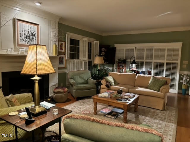 7 Hastings Square Durham, NC 27707 - Photo 12 of 28 a living room with furniture a lamp wooden floor and a table