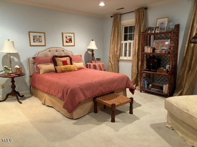 7 Hastings Square Durham, NC 27707 - Photo 19 of 28 a bedroom with a bed and a cabinets