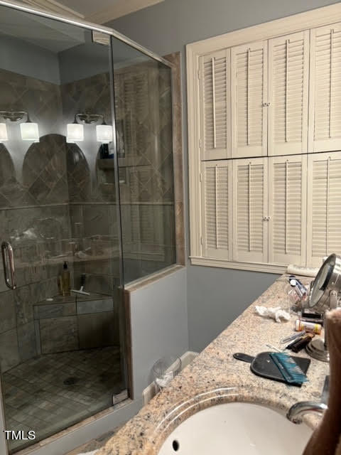 7 Hastings Square Durham, NC 27707 - Photo 7 of 28 a bathroom with a granite countertop sink a mirror and shower