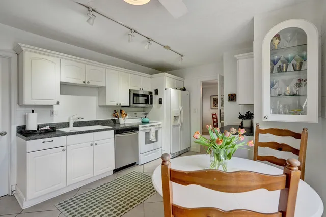 a bedroom with a bed table and window