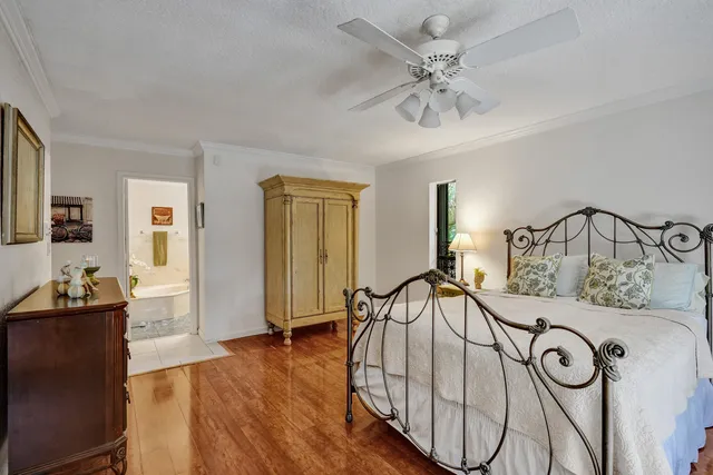 a bed room with a bed and a television