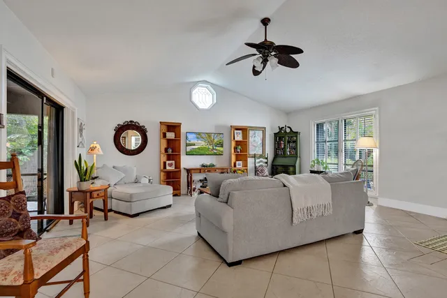 a living room with couches and a window