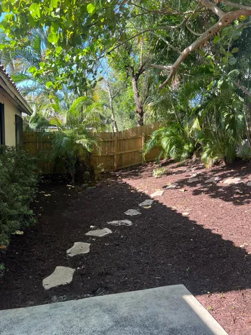 a backyard of a house with lots of green space