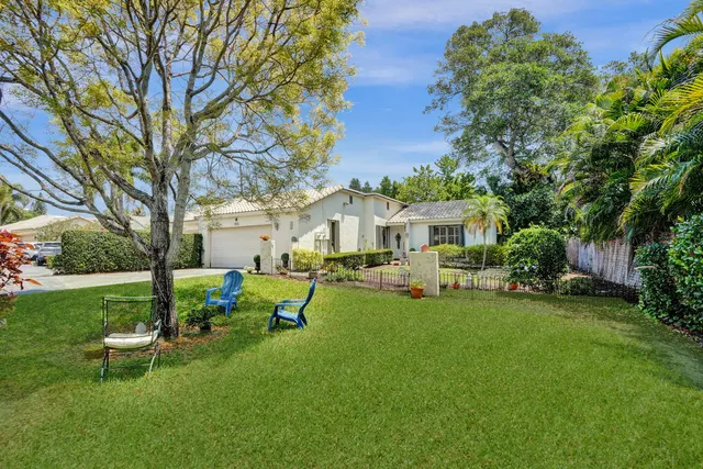 an aerial view of a house with a garden