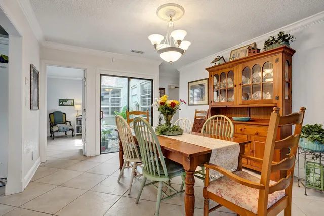 a view of a kitchen with a sink wooden floor and a window