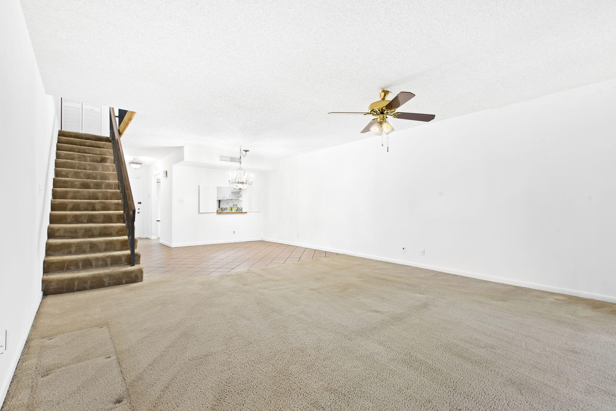 6491 Racquet Club Drive, Unit 36 Lauderhill, FL 33319 - Photo 12 of 24 a view of an empty room with a ceiling fan and window