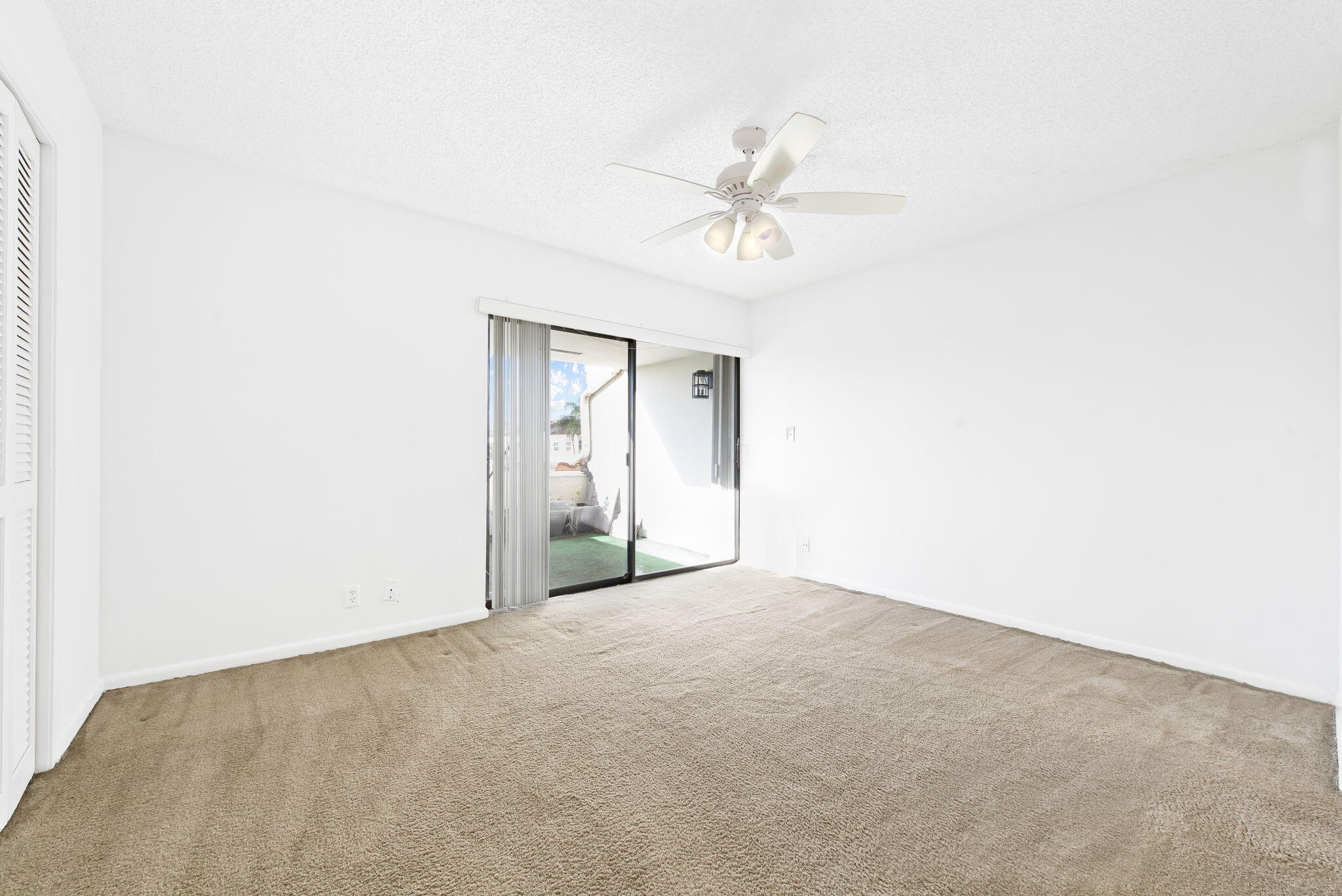 6491 Racquet Club Drive, Unit 36 Lauderhill, FL 33319 - Photo 13 of 24 an empty room with a fan & a window