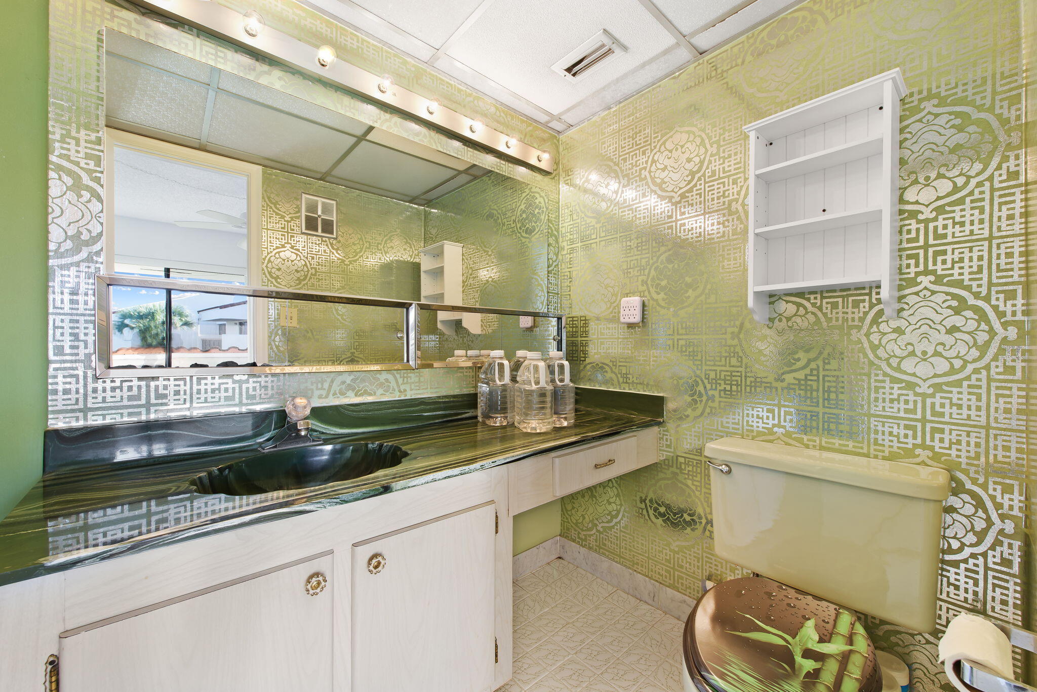 6491 Racquet Club Drive, Unit 36 Lauderhill, FL 33319 - Photo 15 of 24 a bathroom with a granite countertop sink a toilet a mirror and bathtub