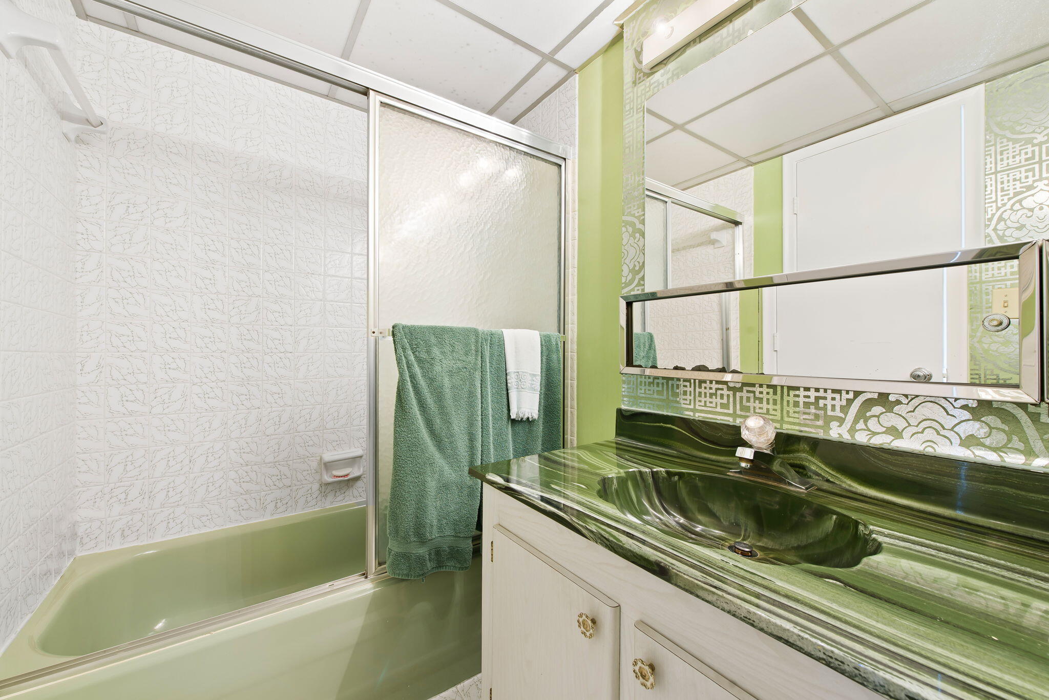 6491 Racquet Club Drive, Unit 36 Lauderhill, FL 33319 - Photo 16 of 24 a bathroom with a granite countertop sink and a bathtub