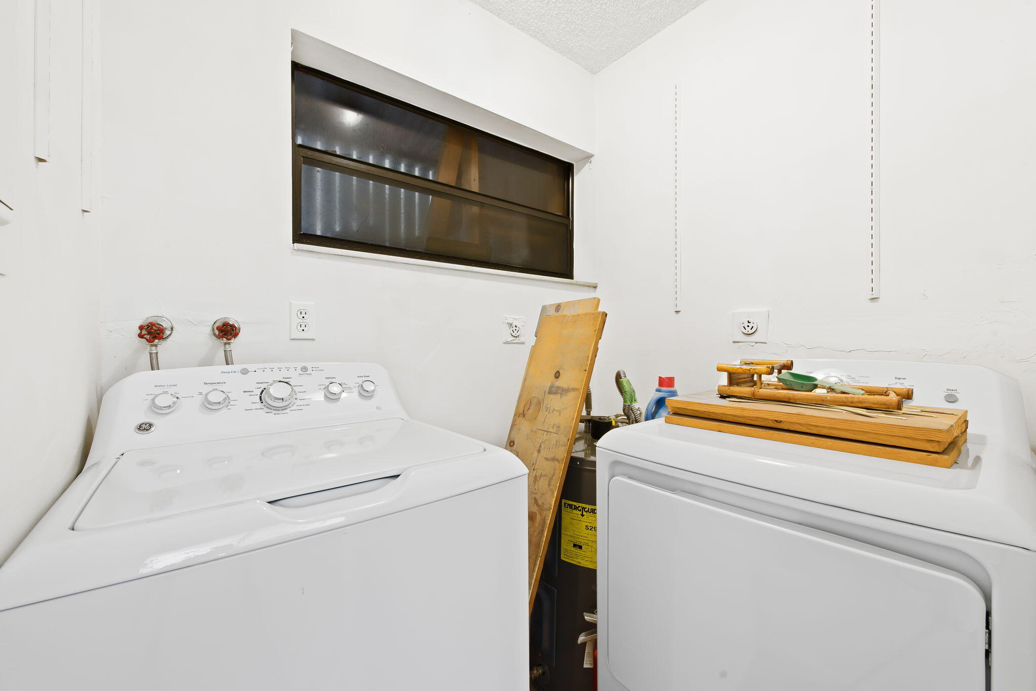 6491 Racquet Club Drive, Unit 36 Lauderhill, FL 33319 - Photo 5 of 24 a utility room with dryer and washer