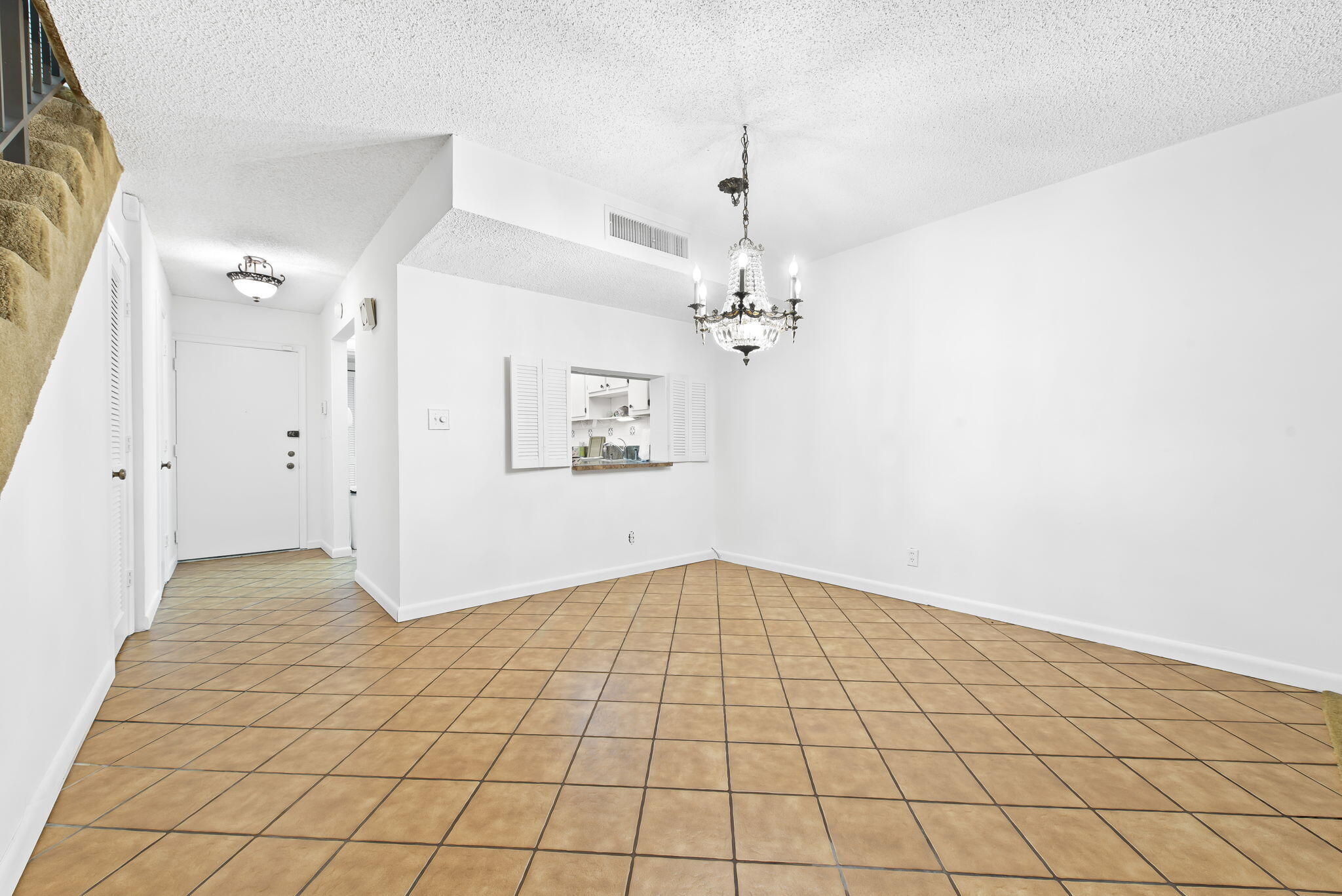 6491 Racquet Club Drive, Unit 36 Lauderhill, FL 33319 - Photo 9 of 24 an empty room with white walls and tiles