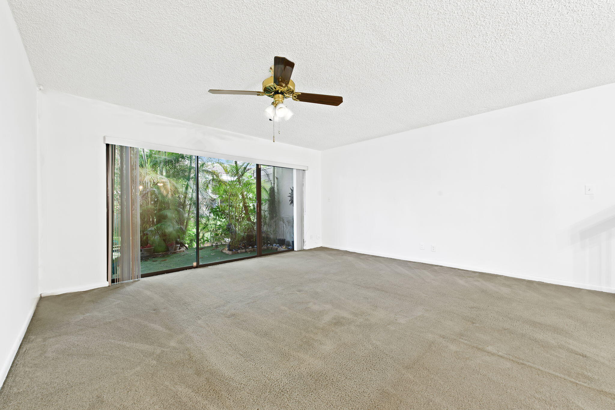 6491 Racquet Club Drive, Unit 36 Lauderhill, FL 33319 - Photo 10 of 24 a view of an empty room with windows