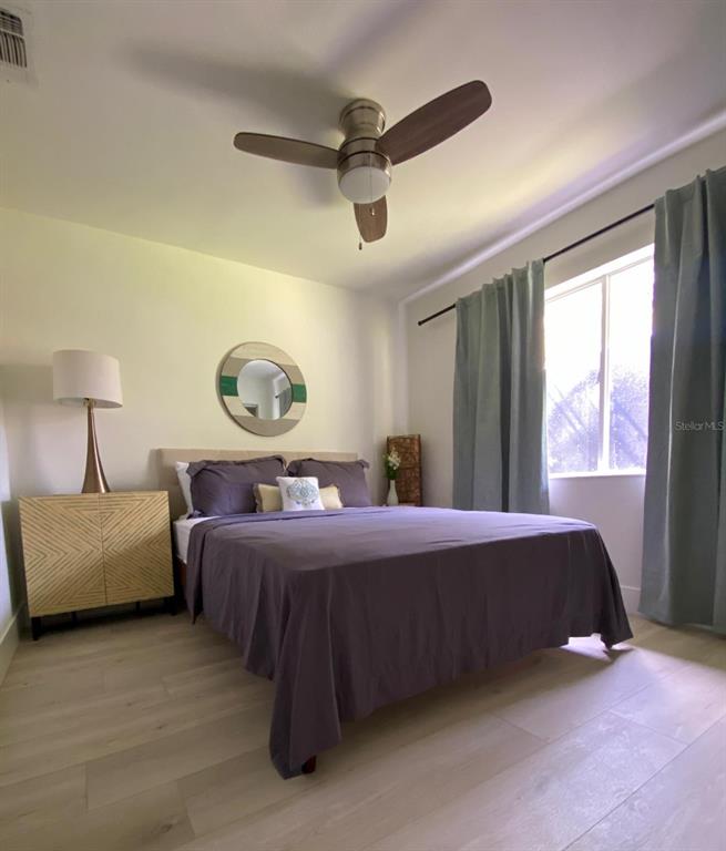 415 Mapleway, Unit A & B Safety Harbor, FL 34695 - Photo 22 of 56 a bed room with a bed and a window