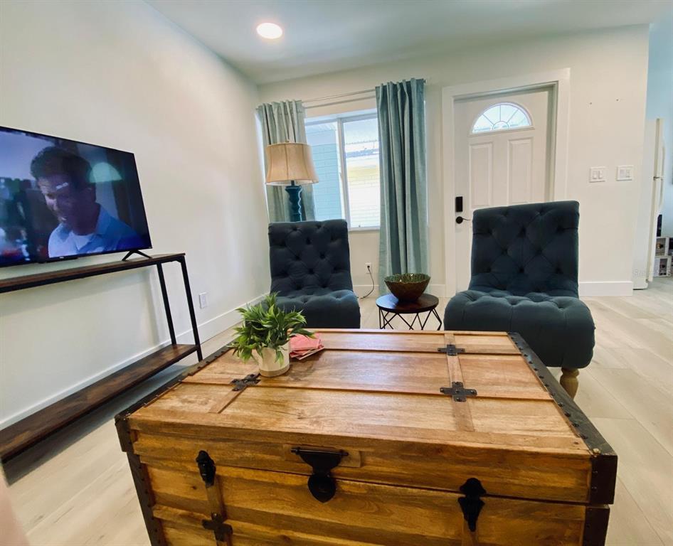 415 Mapleway, Unit A & B Safety Harbor, FL 34695 - Photo 27 of 56 a living room with furniture and wooden floor
