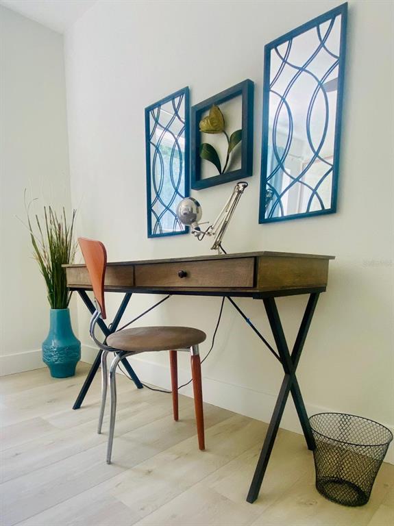 415 Mapleway, Unit A & B Safety Harbor, FL 34695 - Photo 40 of 56 a work room with furniture and a potted plant